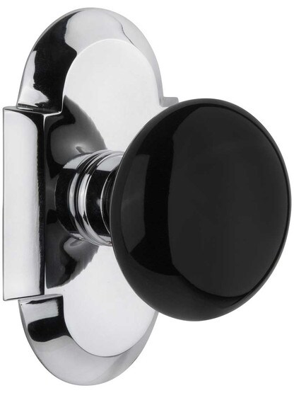 Arched Rosette Door Set with Black Porcelain Knobs in Polished Chrome.